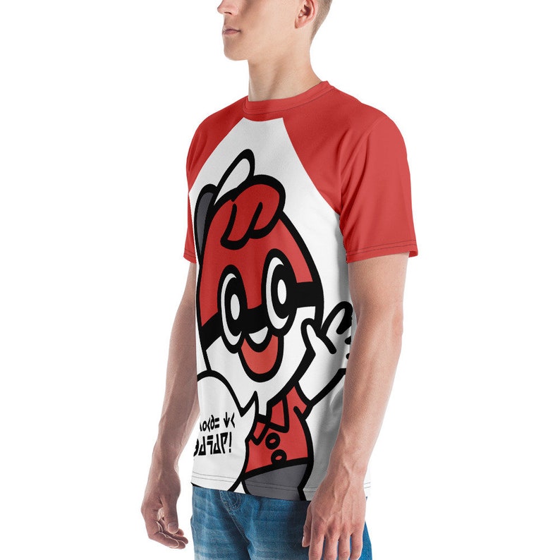May include: A red and white graphic t-shirt featuring a cartoon character with a red and black design. The character has large eyes and is pointing with one hand. The shirt has red sleeves and a white body, with text in a speech bubble.