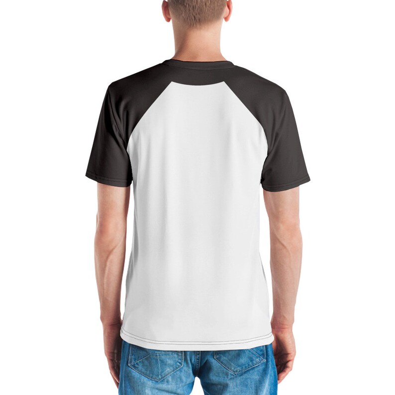 May include: A white and black baseball raglan t-shirt. The shirt has a white front and black sleeves.