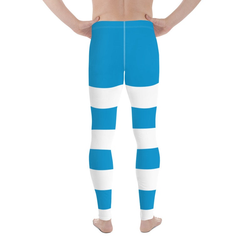 May include: Blue and white striped leggings. The leggings have a wide horizontal stripe pattern.