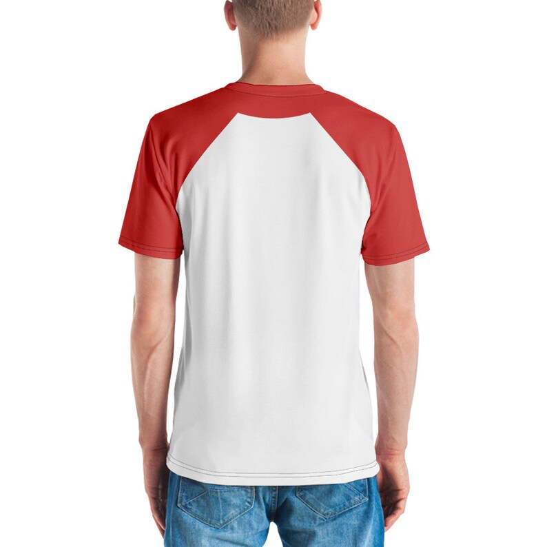 May include: White and red raglan t-shirt. The shirt has a white body with red sleeves and a red crew neck. The back of the shirt is visible, showing the raglan sleeve design. The shirt is made of a soft, comfortable material.