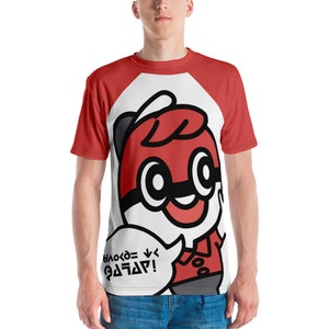 May include: Red and white raglan t-shirt featuring a cartoon character with a red and black design. The character has large eyes and a speech bubble with text. The shirt is worn by a person.