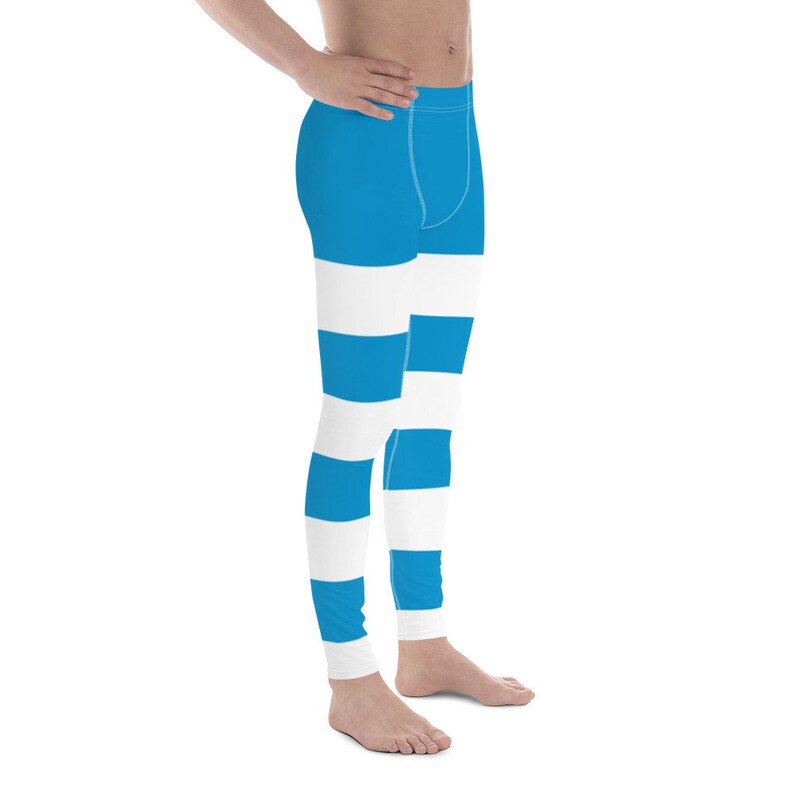May include: Blue and white striped leggings. The leggings have a wide horizontal stripe pattern.
