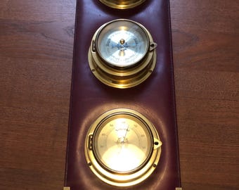 Maritime weather station vintage brass instruments barometer, hygrometer, thermometer.