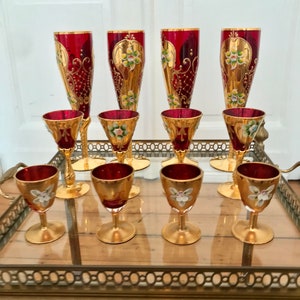 Original Venetian Murano Tre Fuocchi 12-piece glass set. 24K gold leaf enamel on ruby red glass. Matches various sets. Elegant!