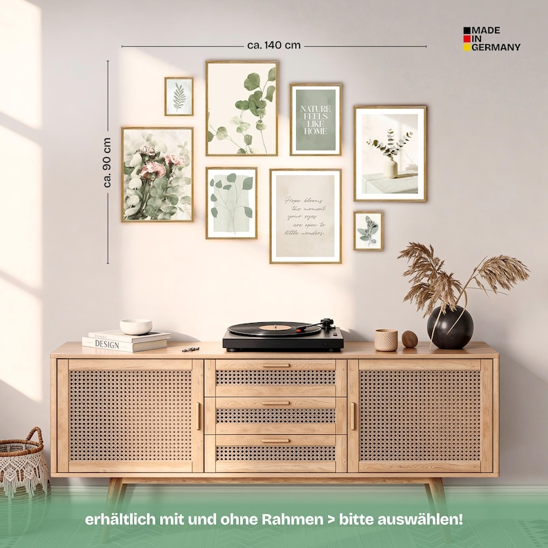 May include: A gallery wall of framed botanical prints and artwork, arranged above a wooden cabinet. The wall art includes images of eucalyptus, floral arrangements, and inspirational quotes. The wall art measures approximately 35 inches high and 55 inches wide.