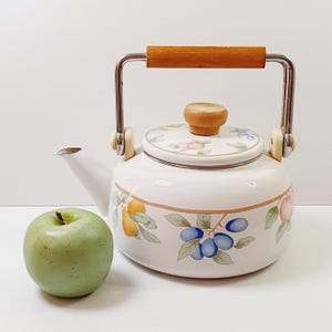 Vintage 1980s tea kettle with wooden handle. Fruit decorated.