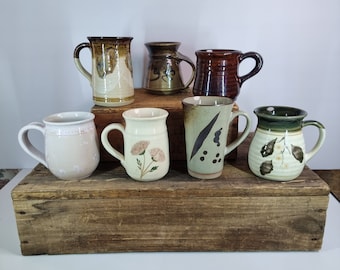 Handmade pottery mugs. Each sold separately.