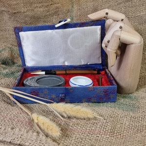 Vintage boxed oriental calligraphy set.