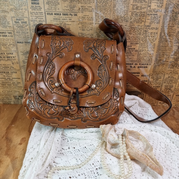 Vintage 1970s tooled leather shoulder bag.