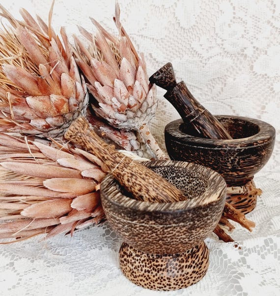 Genuinely handcrafted from Thai sugar palm wood — a dense, characterful hardwood rarely seen in Western kitchenware — these mortars have the tactile, aged soul of something sourced from a Bangkok market stall.