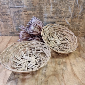 2 vintage wicker baskets.