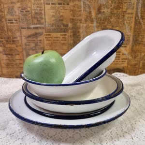 Enamel diningware item collection. 9 Pieces.