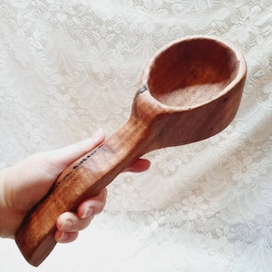 Handcrafted wooden drinking vessel.
