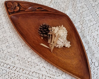 Hand carved wooden bowl. Floral detail.