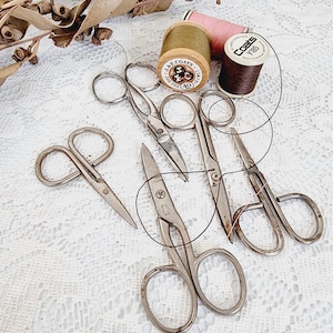 5 Pairs of small vintage scissors.