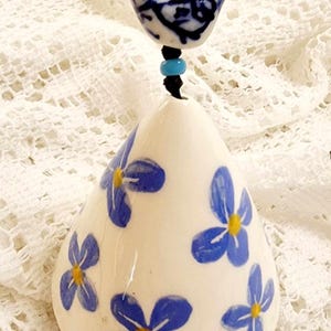 Hand crafted ceramic bell with bird.