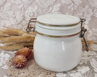 Vintage milk glass canister jar with wire bale clamp closure.