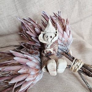 Handmade clay man figurine.