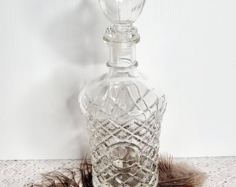 Vintage pressed glass decanter bottle.