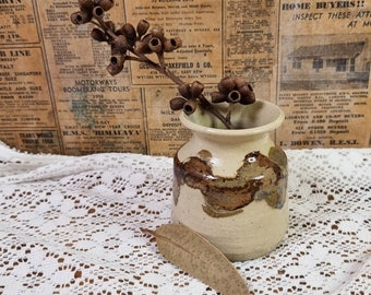 Small hand thrown pottery vase.