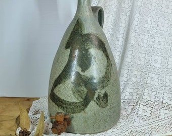 Hand thrown studio pottery water dispenser.