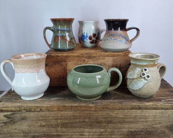 Handmade pottery mugs. Each sold separately.