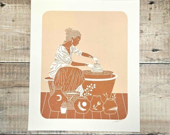 May include: A white line drawing of a person working on a pottery wheel with a variety of pottery pieces around them. The background is a light peach color and the pottery pieces are a light brown color.