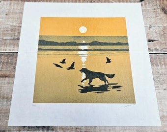 Original limited edition reduction linocut print of a dog chasing birds at sunset on a beach (12)