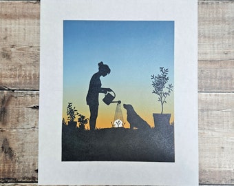 Watering the Seedlings- Original limited edition linocut reduction print of a woman watering her garden with her dog