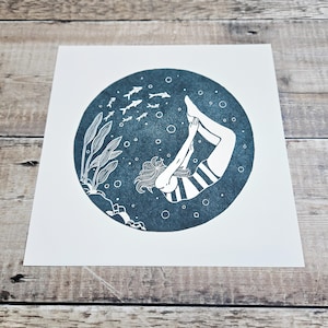 Wonder - Archival quality Giclée print recreated from my original linocut featuring a woman swimming underwater with fish