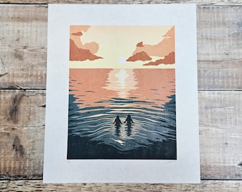 Into the Sun- Original limited edition linocut print of two people walking in to the sea under a sunrise/sunset