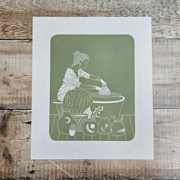 The Potter- Original limited edition (7) linocut print of a Potter throwing a ceramic pot on the pottery wheel