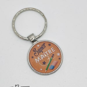 Zilveren sleutelhanger met cabochon bedrukt 25mm oranje boodschap "super master" (geschenkpakket aangeboden) ideaal cadeau einde van het jaar. Uniek