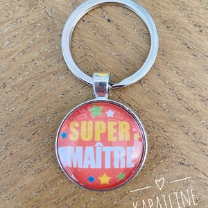 Zilveren en rode sleutelhanger met cabochon met boodschap "super master" (geschenkpakket aangeboden) ideaal cadeau eindejaars
