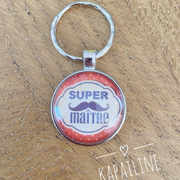 Porte clé argenté et orange avec cabochon à message « super maître» (paquet cadeau offert) idéal cadeau fin d’année