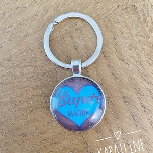 Zilveren, blauwe en paarse sleutelhanger met "supermeester" bericht cabochon (cadeaupakket aangeboden) ideaal eindejaarscadeau