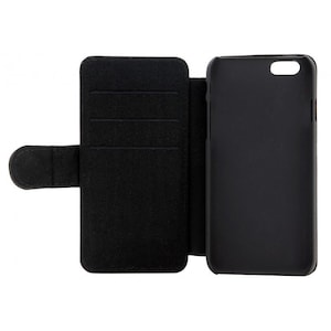 May include: Black leather phone case with a flap that folds over the screen. The case has three card slots on the inside of the flap.