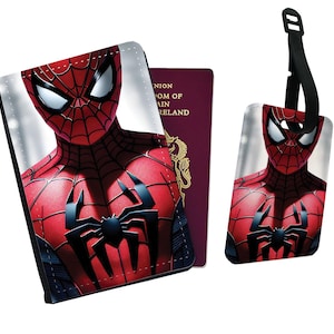 May include: A red and black passport holder and luggage tag featuring a close-up of Spider-Man's face. The passport holder has a black border and the luggage tag has a black strap.
