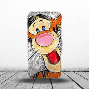May include: A colorful phone case with a cartoon illustration of Tigger from Winnie the Pooh. The case has a white background with orange, yellow, red, and blue paint splatters.