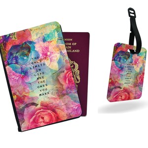 May include: A passport holder and luggage tag with a floral design in shades of pink, blue, and purple. The passport holder and luggage tag have the text "THE ONLY LIMITS IN LIFE ARE THE ONES YOU MAKE". The passport holder is black.