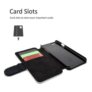 May include: A black leather phone case with a flap that opens to reveal card slots. The case has a black phone inside and two cards are visible in the slots.