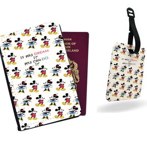 May include: A white passport holder and luggage tag featuring a repeating pattern of Mickey Mouse. The passport holder has a black border and the text "IF YOU DREAM IT YOU CAN DO IT". A burgundy passport is visible.