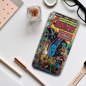 May include: A vintage comic book cover featuring the Avengers, with the text "Behold... the Guardians of the Galaxy!"  The cover is in a retro style with a colorful illustration of the Avengers fighting.