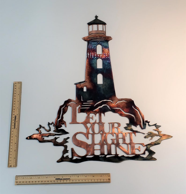 Let Your Light Shine with Lighthouse Home Decor Metal Wall