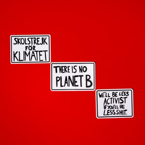 May include: Three white square stickers with black text on a red background. The top sticker says "SKOLSTREJK FOR KLIMATET". The middle sticker says "THERE IS NO PLANET B". The bottom sticker says "WE'LL BE LESS ACTIVIST IF YOU'LL BE LESS SHIT."
