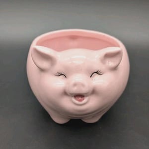 May include: A white ceramic mug with a black handle and the text "But First, Coffee" in a handwritten style. The mug is on a white surface. The mug is 4 inches tall.