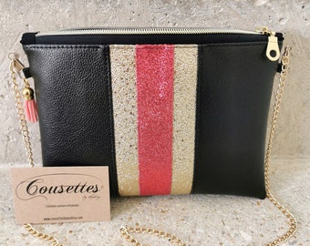 Evening clutch bag in black, gold and pink faux leather.