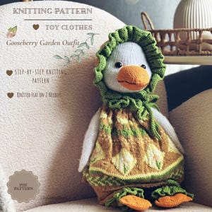 May include: A knitted toy goose wearing a green ruffled bonnet and a brown and green patterned dress with white diamond motifs. The text reads: KNITTING PATTERN, TOY CLOTHES, Gooseberry Garden Outfit, STEP-BY-STEP KNITTING PATTERN, KNITTED FLAT ON 2 NEEDLES, PDF PATTERN.