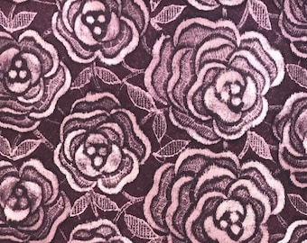 Soft printed polyester dress fabric rose design on plum purple background, 160cm wide, available by the metre