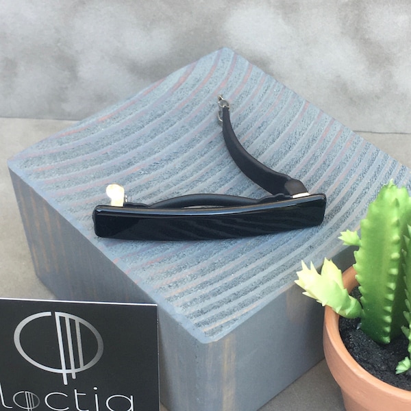 Small black barrette hair clip stays in place lined by Loctia